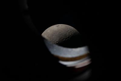 Moon through a camera lens, departing